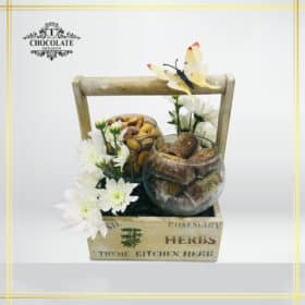 Large Wooden Basket With Fresh Flowers And Chocolate. Belgium chocolate, Delux mixed nuts, and fresh flowers with the butterfly as decorations.